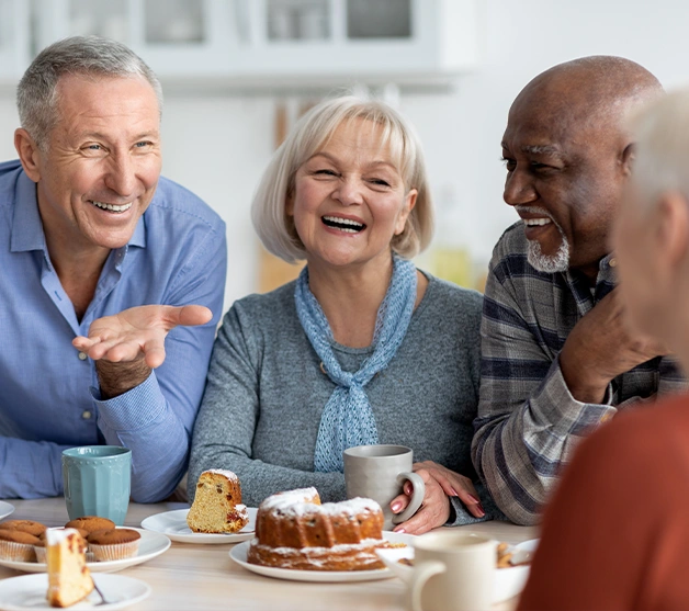 People enjoying conversation over dessert